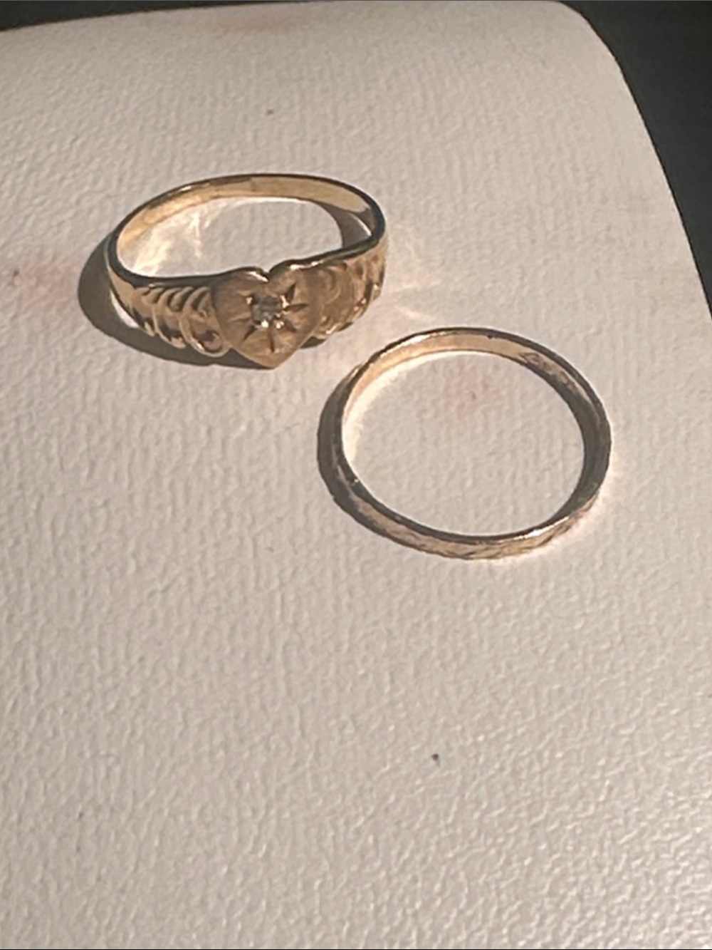 10 k gold, baby rings size shown on ring sizer